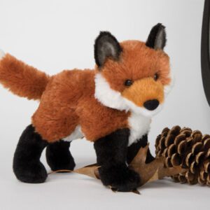 Plush fox toy with pine cone.
